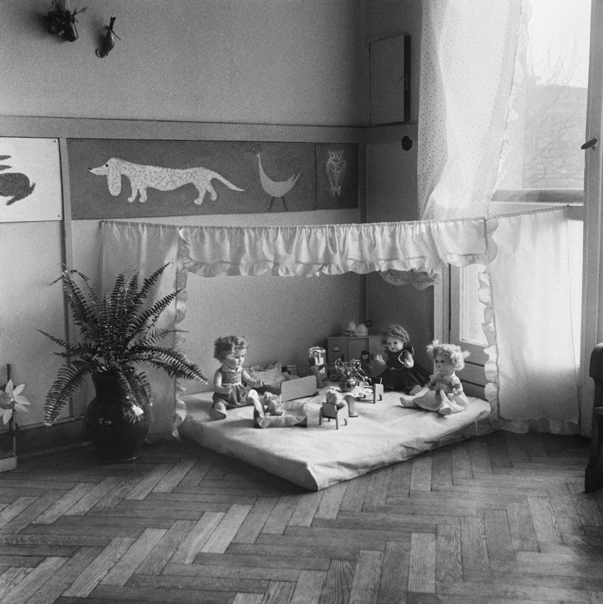 Play corner with dolls.