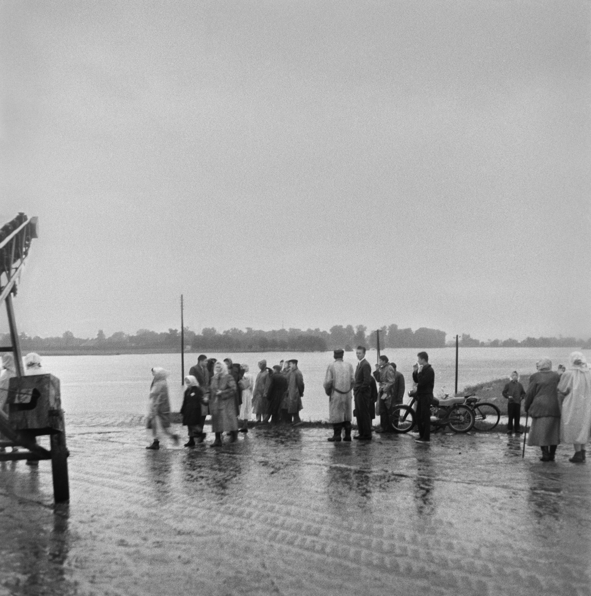 Onlookers gathered on the road that runs along the river bank.