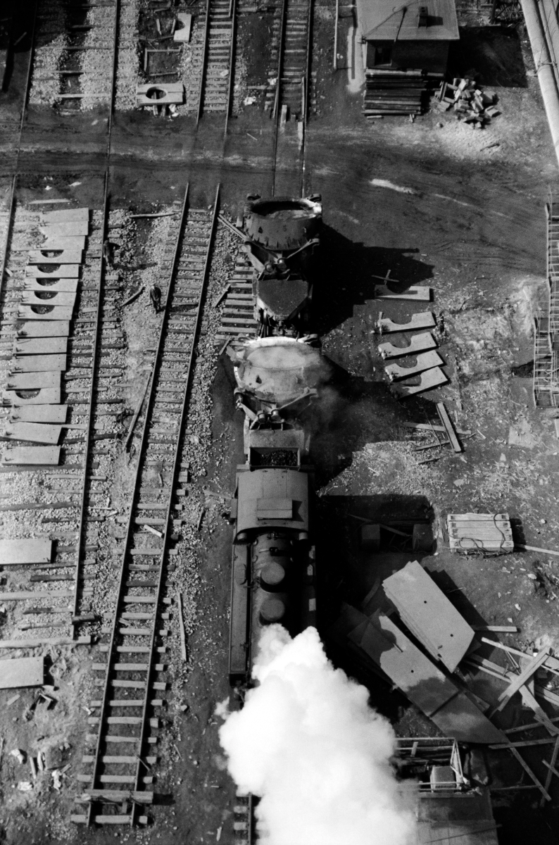 Top view of the transport locomotive, industrial chaos all around.