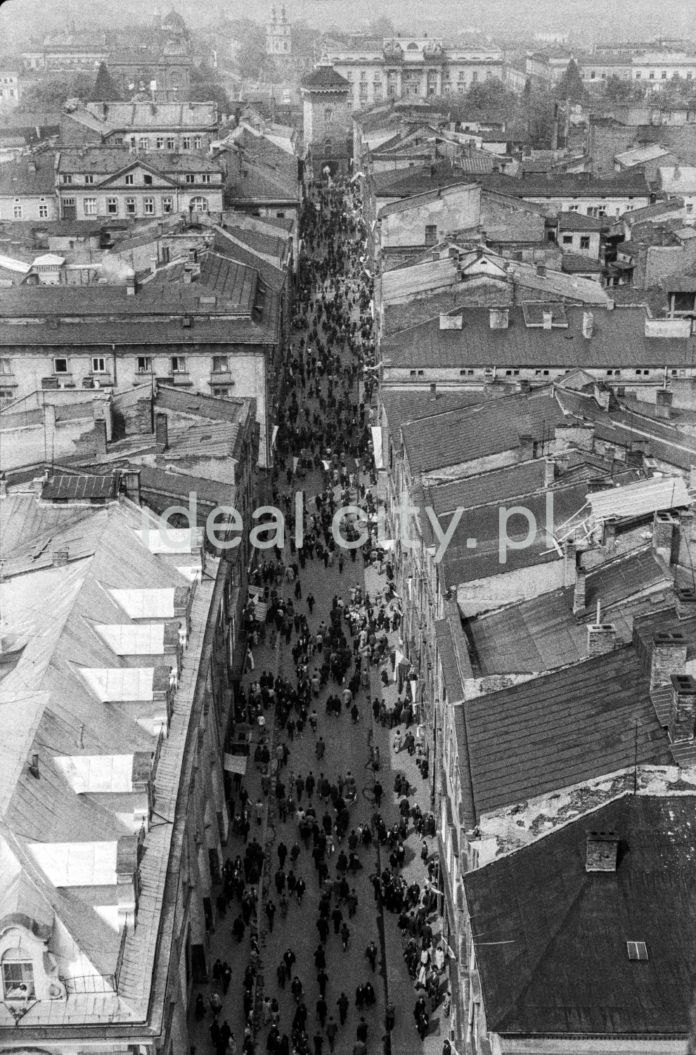 A view from above on a street filled with people in the old part of town.