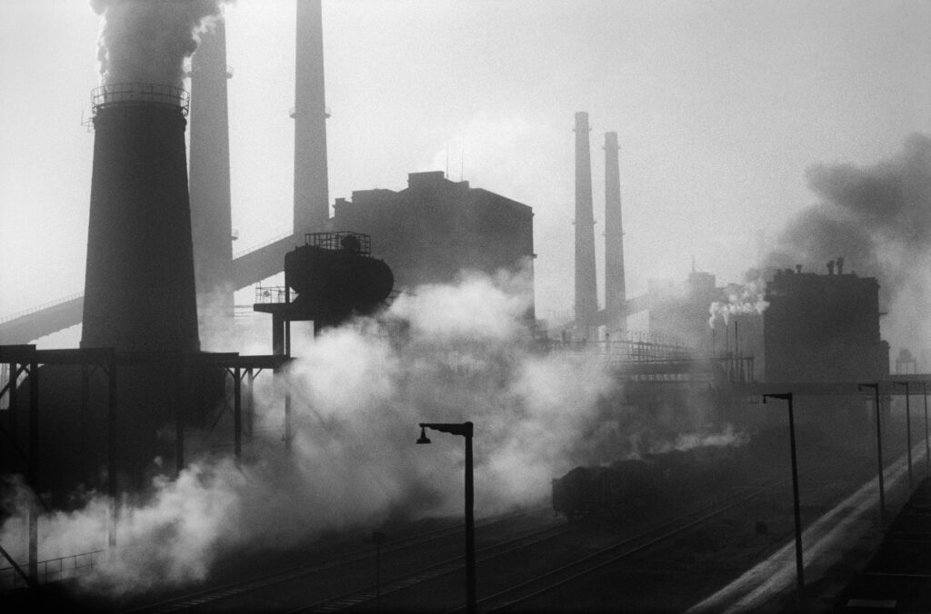 View of the smoking chimneys of the plant.