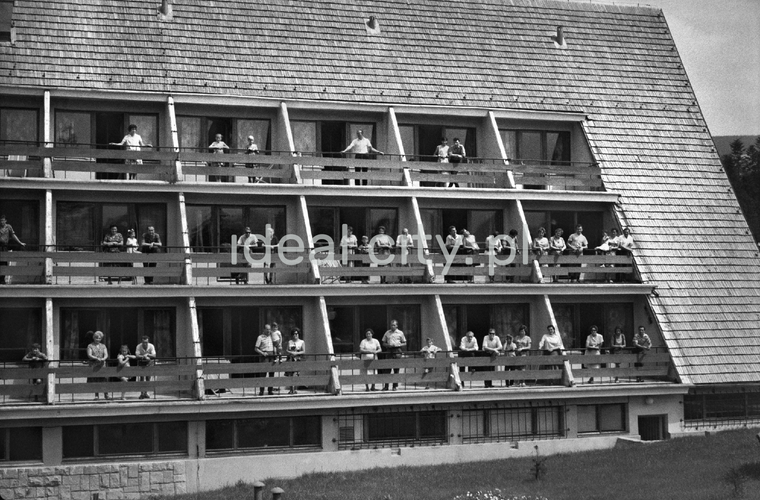 Holidaymakers on the balconies of the holiday home.