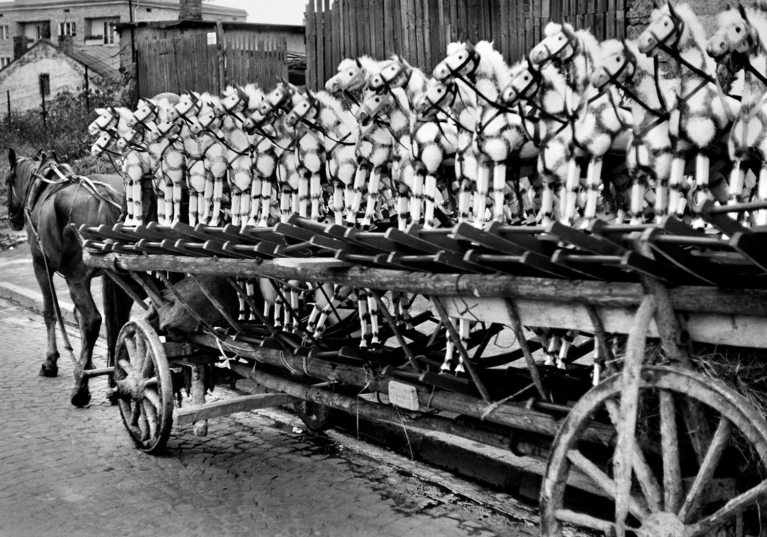 rocking horses on a wooden horse cart